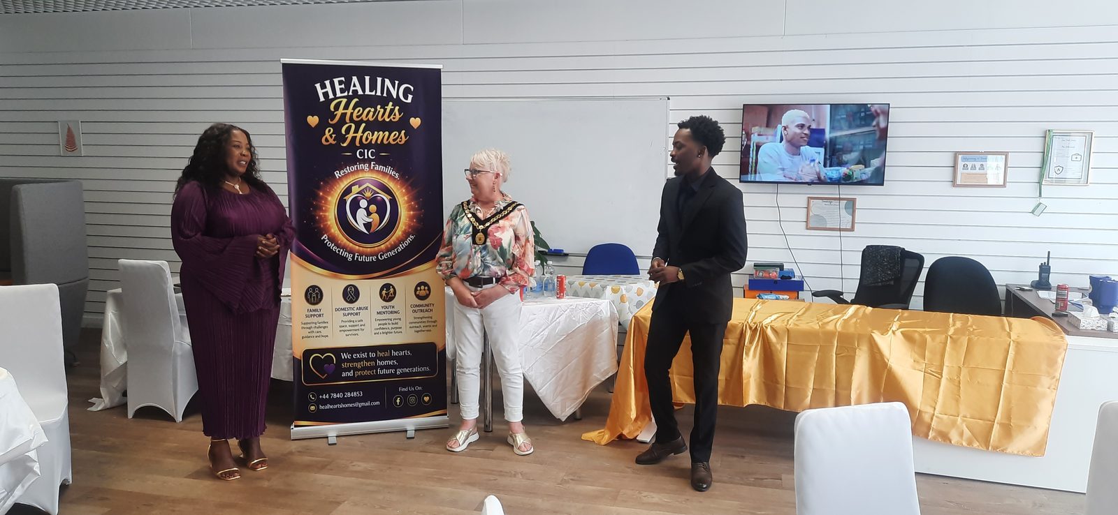 Councillor Julie Vine, Deputy Mayor of Trowbridge, and a Healing Hearts & Homes CIC team member speaking at the launch event